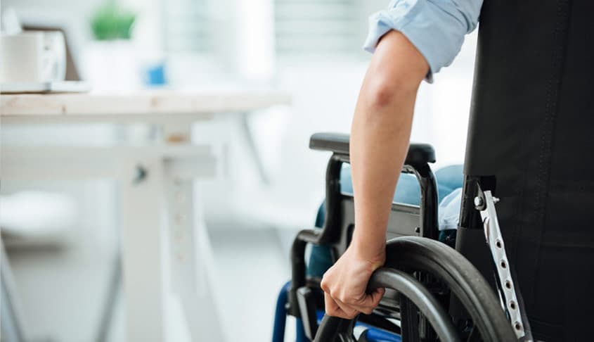 man in wheelchair at doctor's office